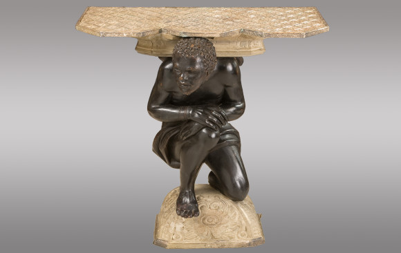 Console <br/>with a carved figure of Blackamoor<br/>and topped with silvered copper